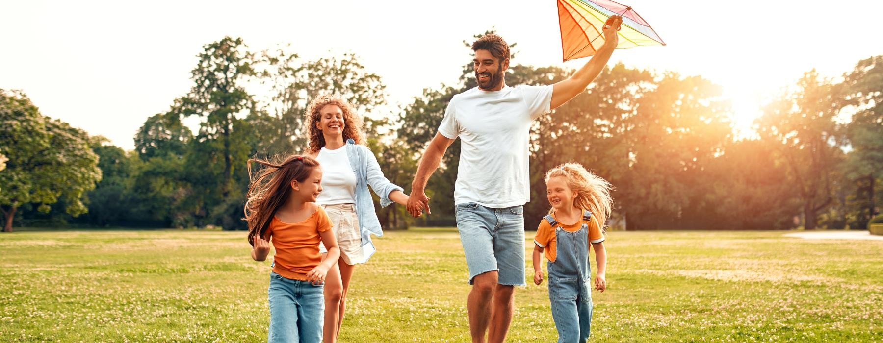 a family running in a park