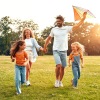 a family playing together in a park