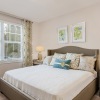 bedroom with large bed window and lamps