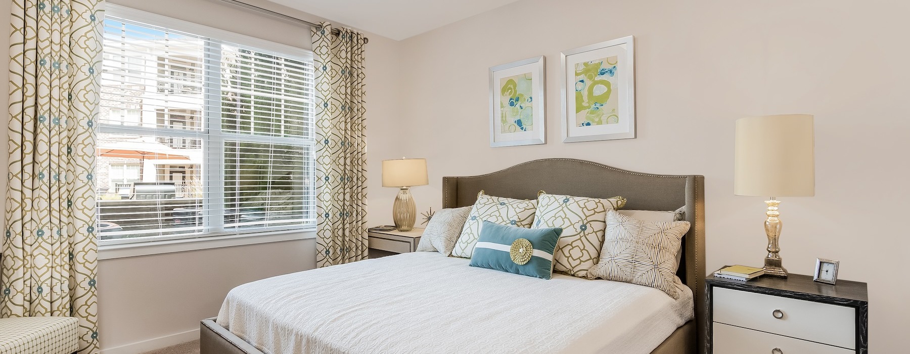 bedroom with large bed window and lamps