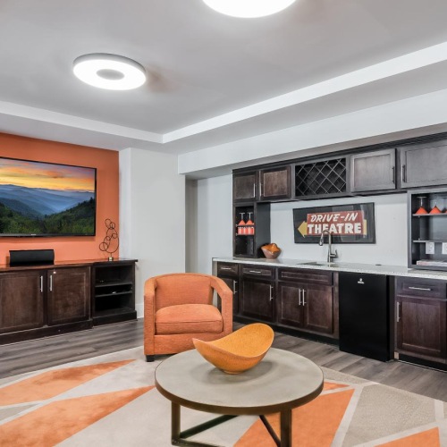 a living room with a tv and couches