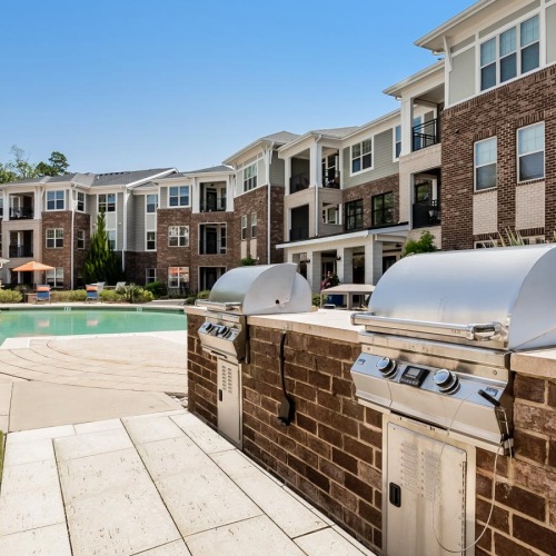 a brick wall with a brick wall and a brick wall with a pool and a brick building and